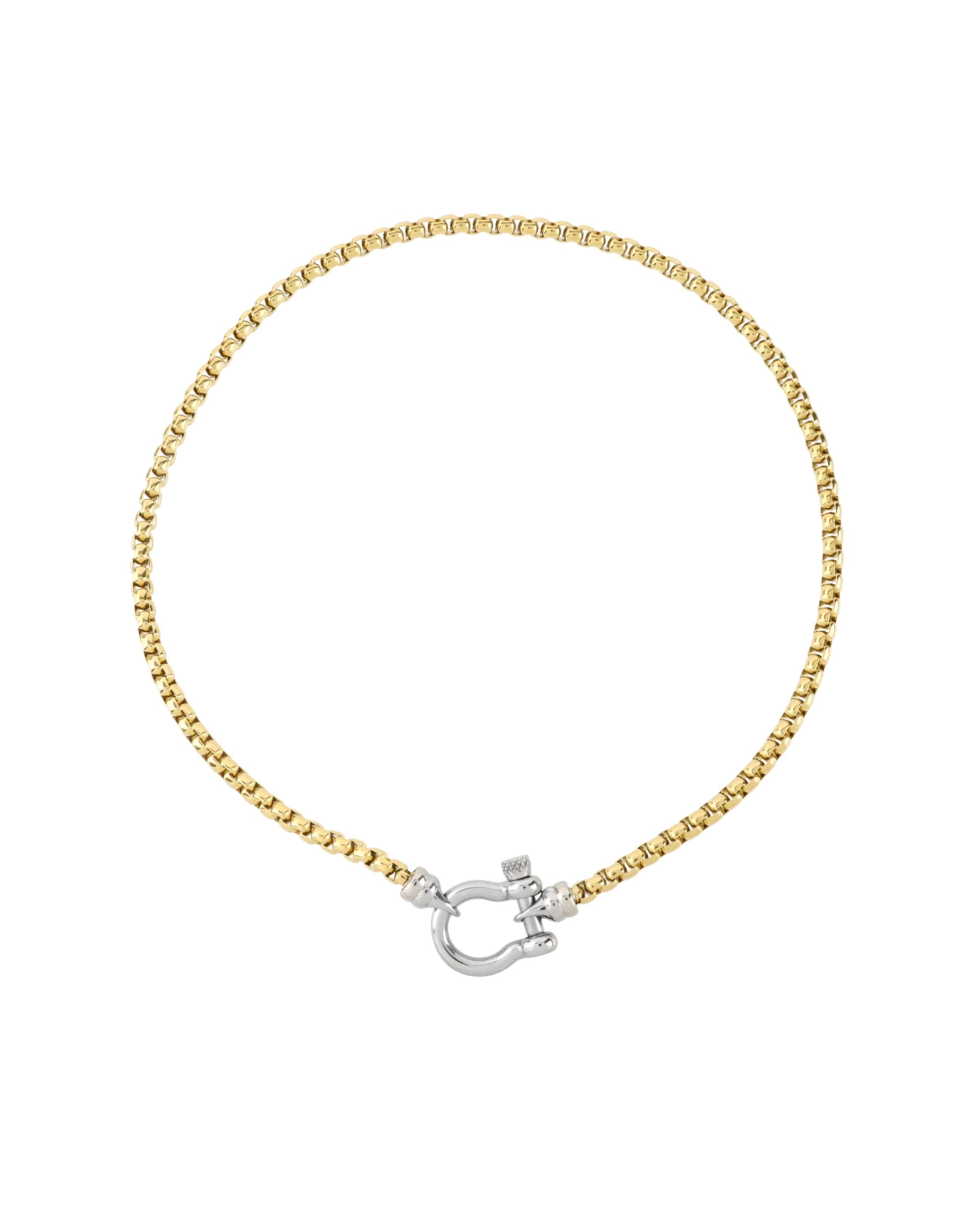 The Herradura Signature Mix, a gold necklace featuring a box chain with a silver horseshoe clasp. ||| SILVER