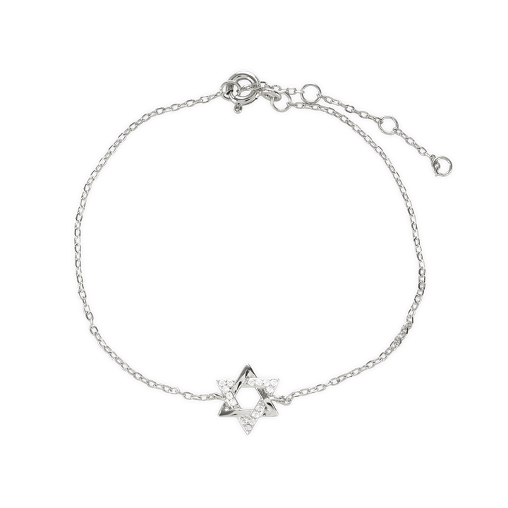 The Fine Guiding Star Bracelet, a delicate silver chain bracelet featuring a star-shaped charm encrusted with sparkling crystals. This elegant piece brings a celestial-inspired touch to any outfit, perfect for wearing alone or layered with other bracelets for a versatile, meaningful look.