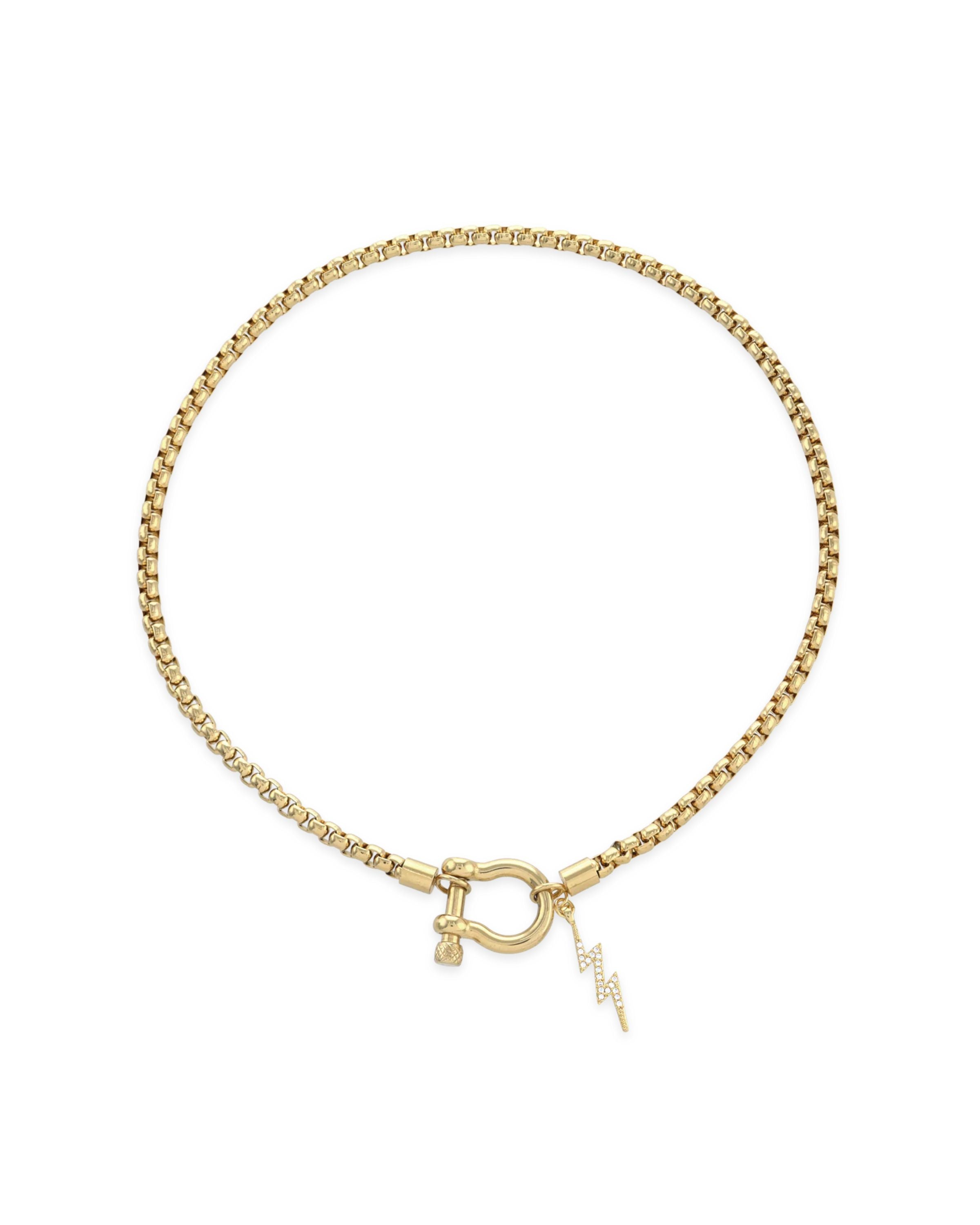 The Herradura Thunder Necklace - Gold, a gold necklace with a lightning bolt charm and a unique horseshoe clasp.