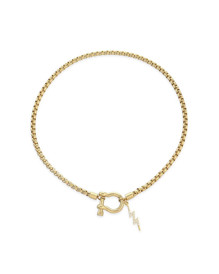 The Herradura Thunder Necklace - Gold, a gold necklace with a lightning bolt charm and a unique horseshoe clasp.