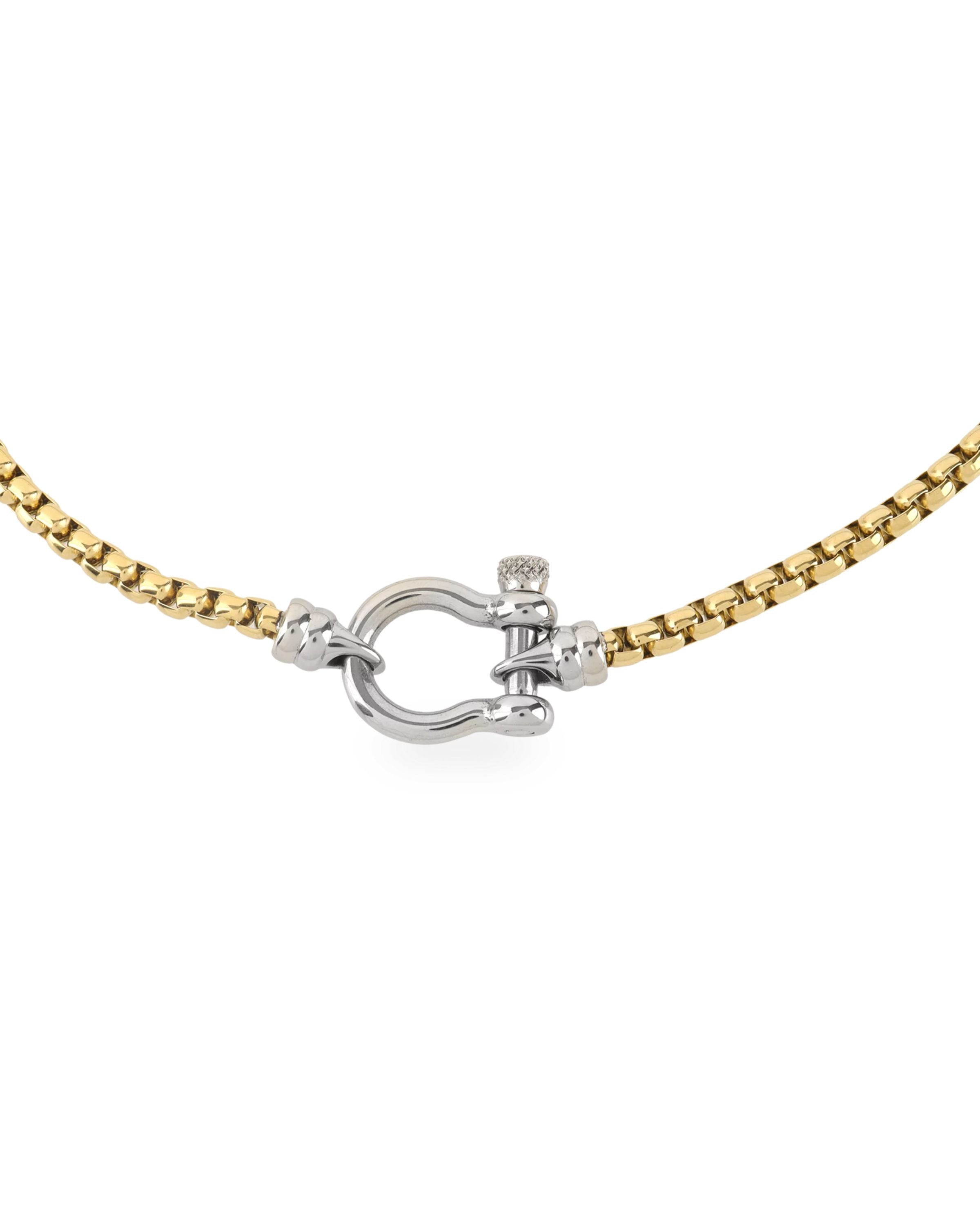 The Herradura Signature Mix, a gold necklace featuring a box chain with a silver horseshoe clasp. ||| SILVER