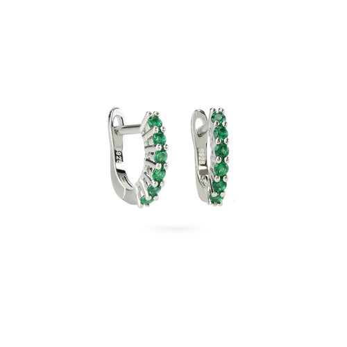 The Prong Emerald Hoops, a pair of silver hoop earrings featuring prong-set emerald accents.