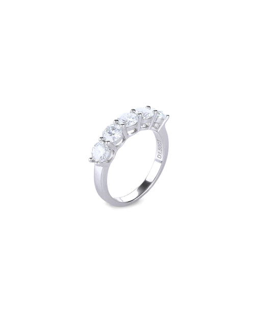 The Diamond Band Ring, a silver ring featuring five dazzling brilliant-cut diamonds.