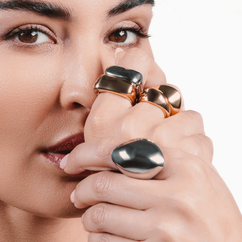 Model wearing the Fierce Ring in silver, featuring a bold and curvy design that exudes confidence and modern elegance. 