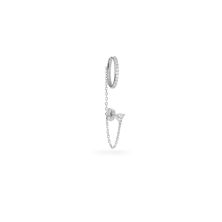 The Ear Cuff with Chain Earring which features a hoop cuff with shimmering diamonds and a dainty chain connected to a pear-shaped diamond earring.