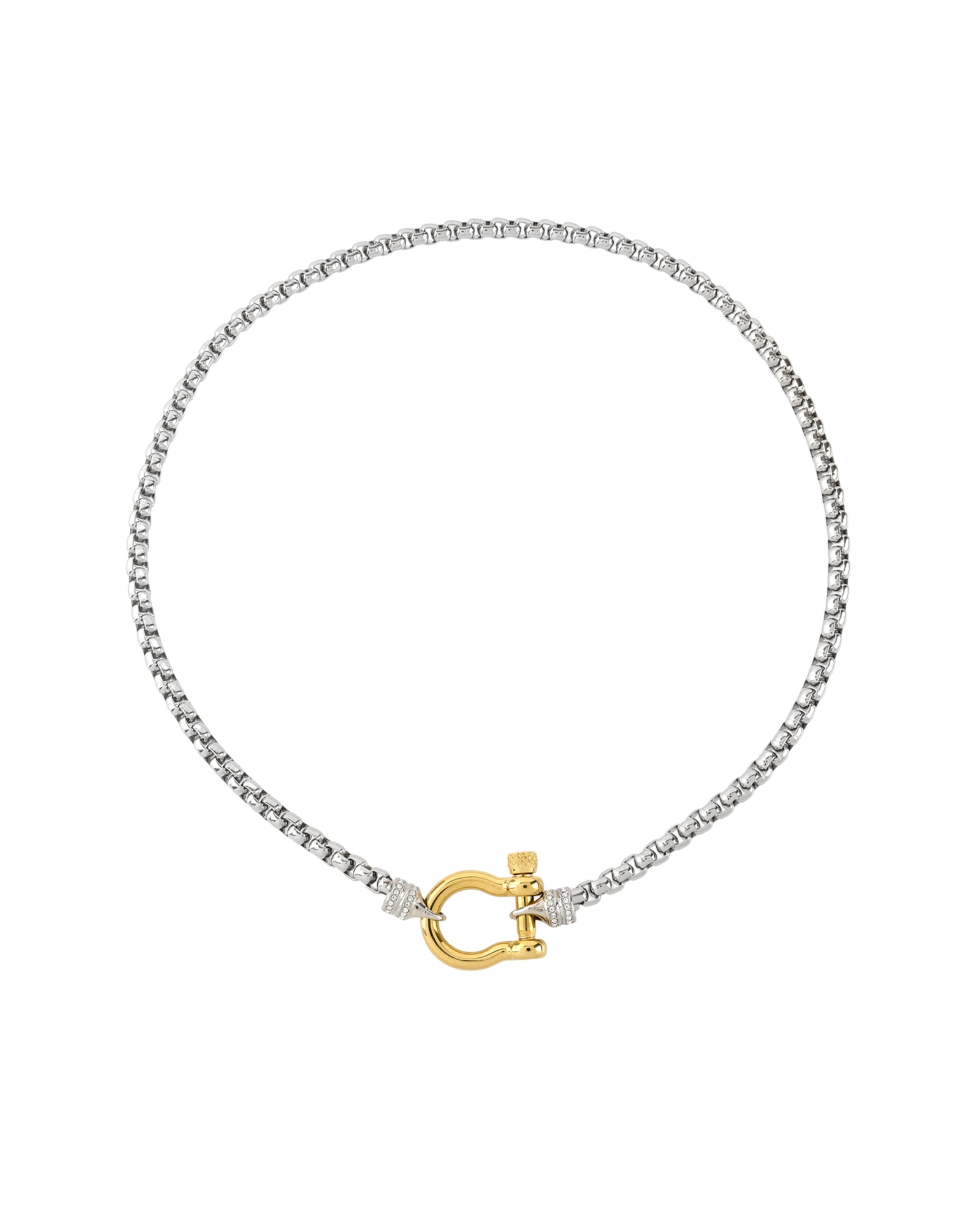 The Herradura Signature Pave Mix, a silver necklace featuring a box chain with a gold horseshoe clasp accented with pave-set diamond-like stones. |||Gold