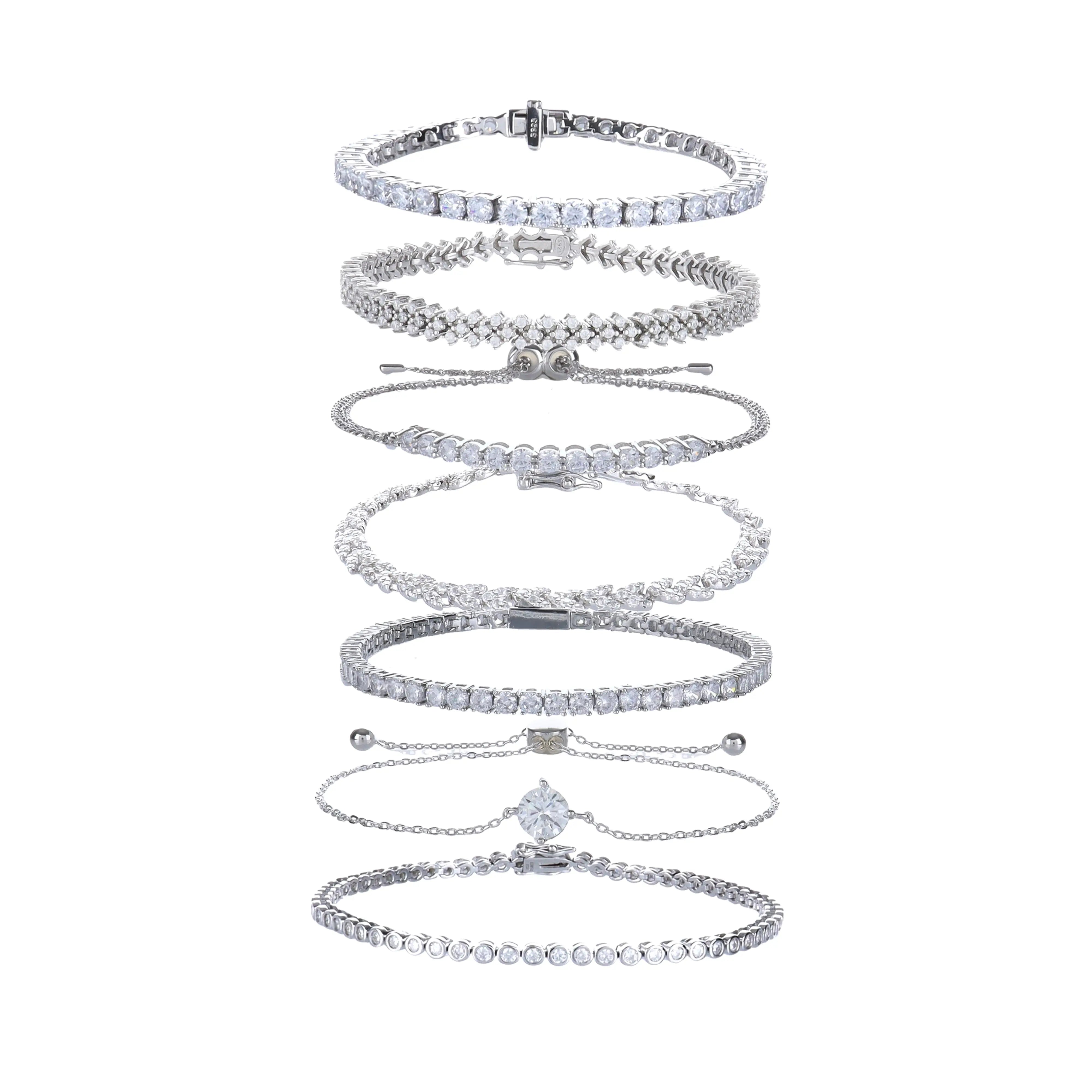 The Supernova Tennis Stack, a set of 8 silver bracelets featuring various styles with sparkling cubic zirconia stones.