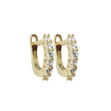 The Prong Hoops, which are a pair of stunning gold hoop earrings, feature dazzling prong-set crystals for an elegant and timeless design. These earrings are crafted with precision and are perfect for elevating any look, whether worn alone or layered with other jewelry pieces. ||| GOLD