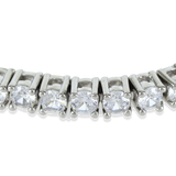 The Tennis Bracelet, which is a single elegant silver-tone bracelet featuring a continuous row of sparkling cubic zirconia stones, designed for timeless sophistication and versatility.