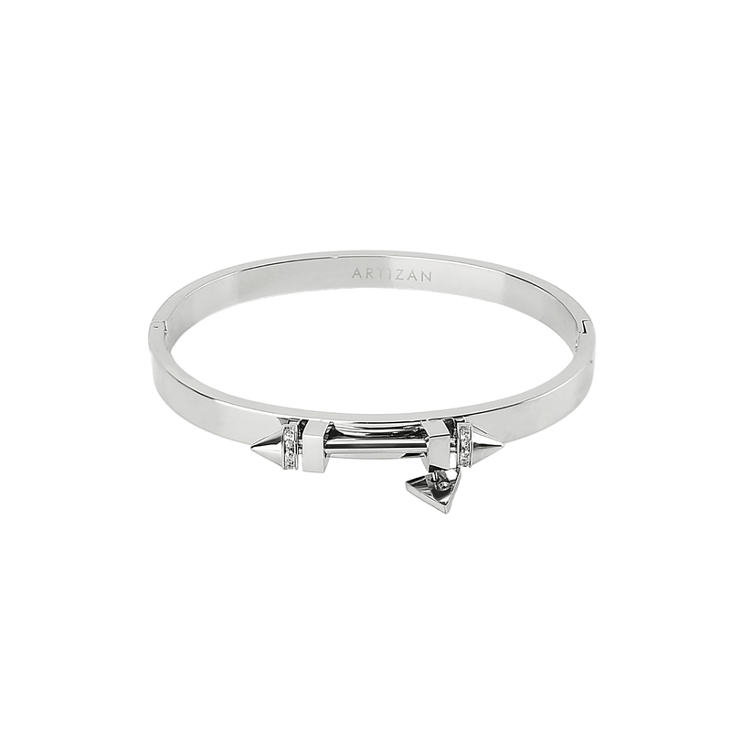The Sasha's bangle made of 316L Stainless steel. It has a bar design on top with two spikes on each end. It has zirconia details and triangle charm as well.