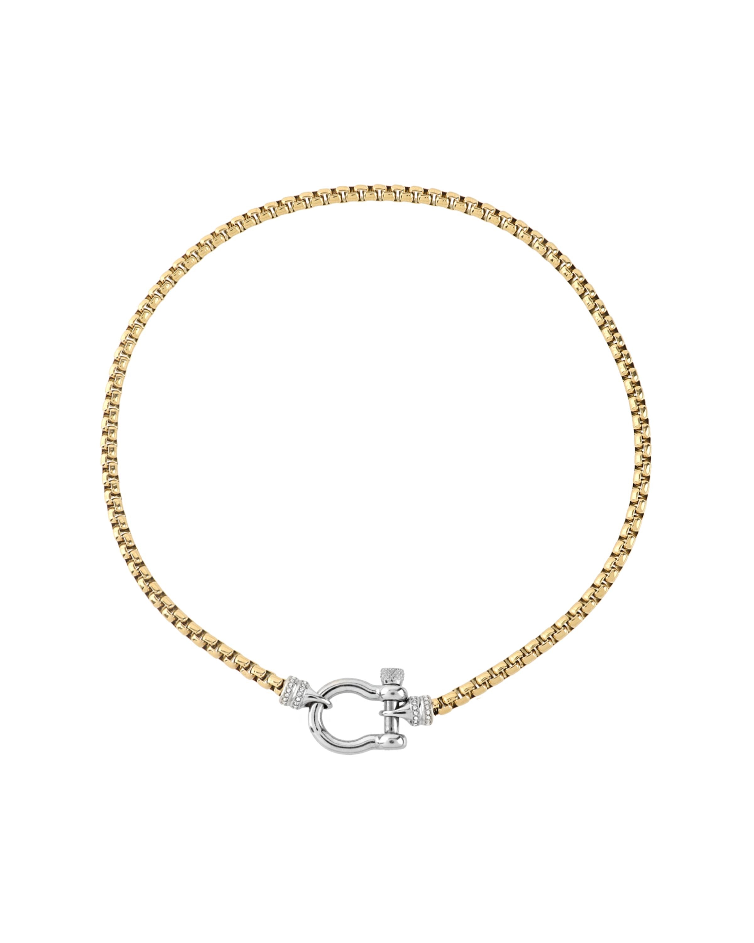 The Herradura Signature Pave Mix, a gold necklace featuring a box chain with a silver horseshoe clasp accented with pave-set diamond-like stones.  |||Silver