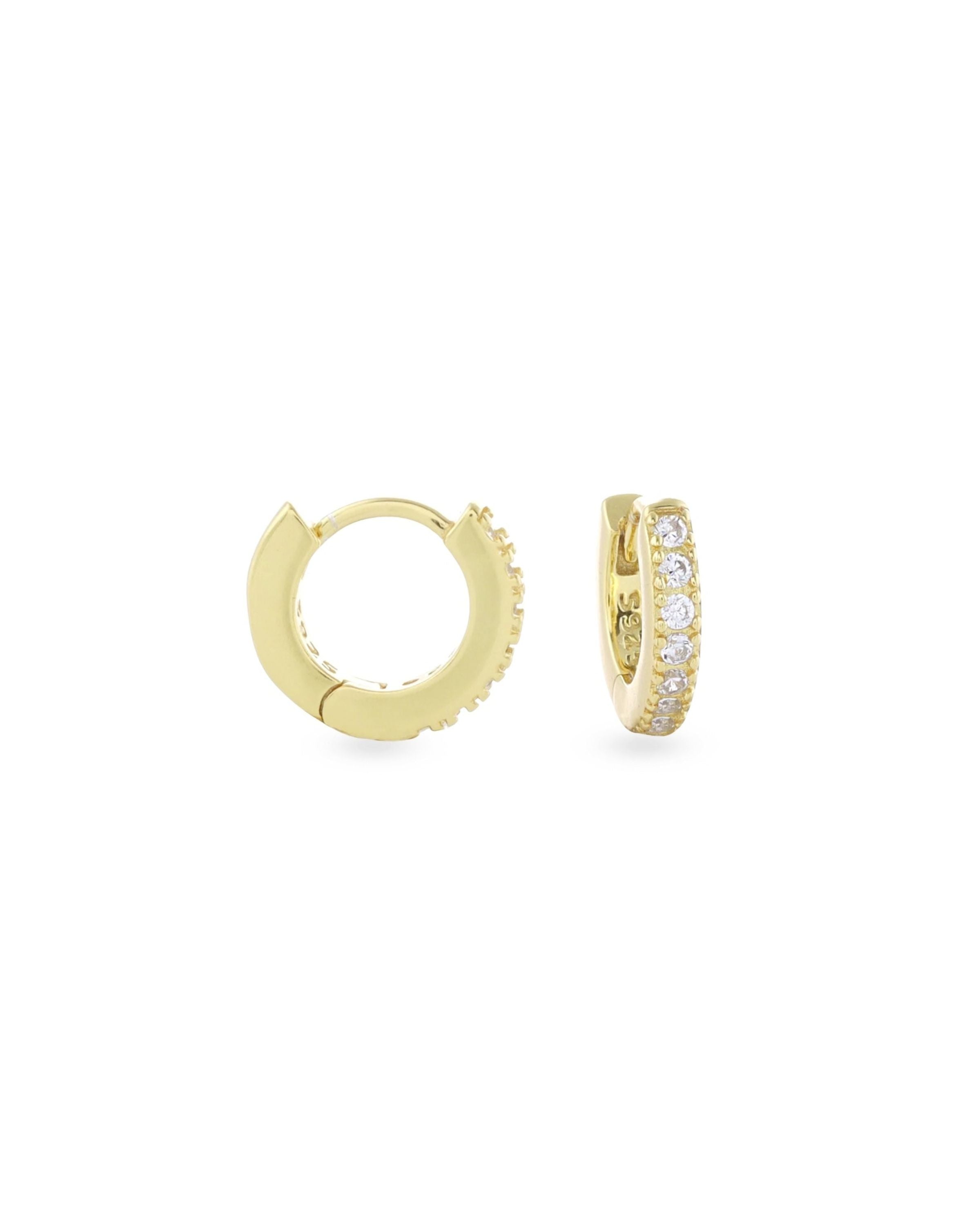The Mini Clear Huggies, a pair of small gold hoop earrings with sparkling clear cubic zirconia stones.||| GOLD