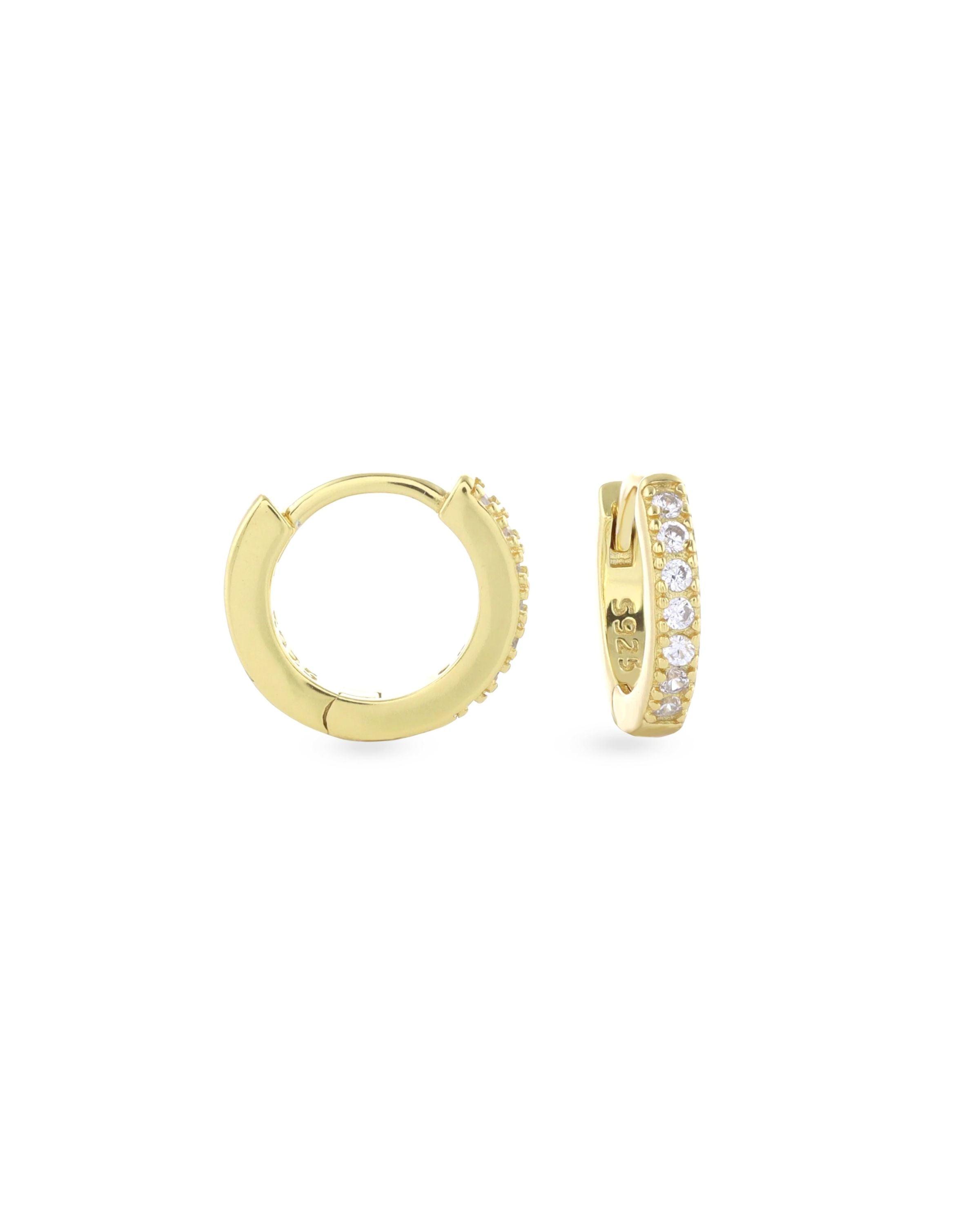 The Mini Clear Huggies, a pair of small gold hoop earrings with sparkling clear cubic zirconia stones.||| GOLD