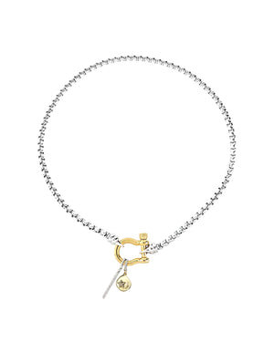 The HERRADURA SIGNATURE DOUBLE TAKE featuring a silver chain with a gold horseshoe clasp and dangling charms, including a pavé bar and a gold star pendant. ||| GOLD
