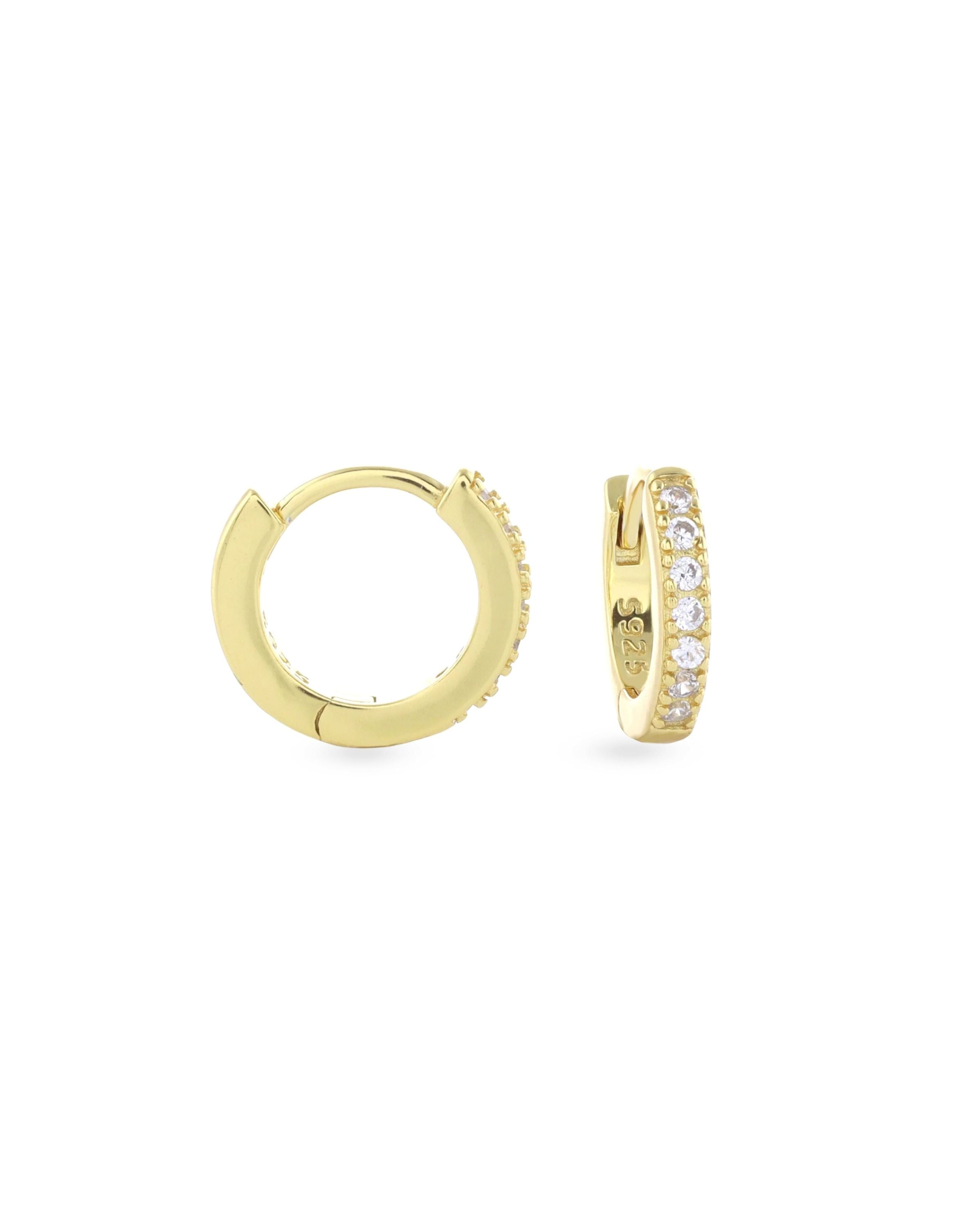 The Mini Clear Huggies, a pair of small gold hoop earrings with sparkling clear cubic zirconia stones.||| GOLD