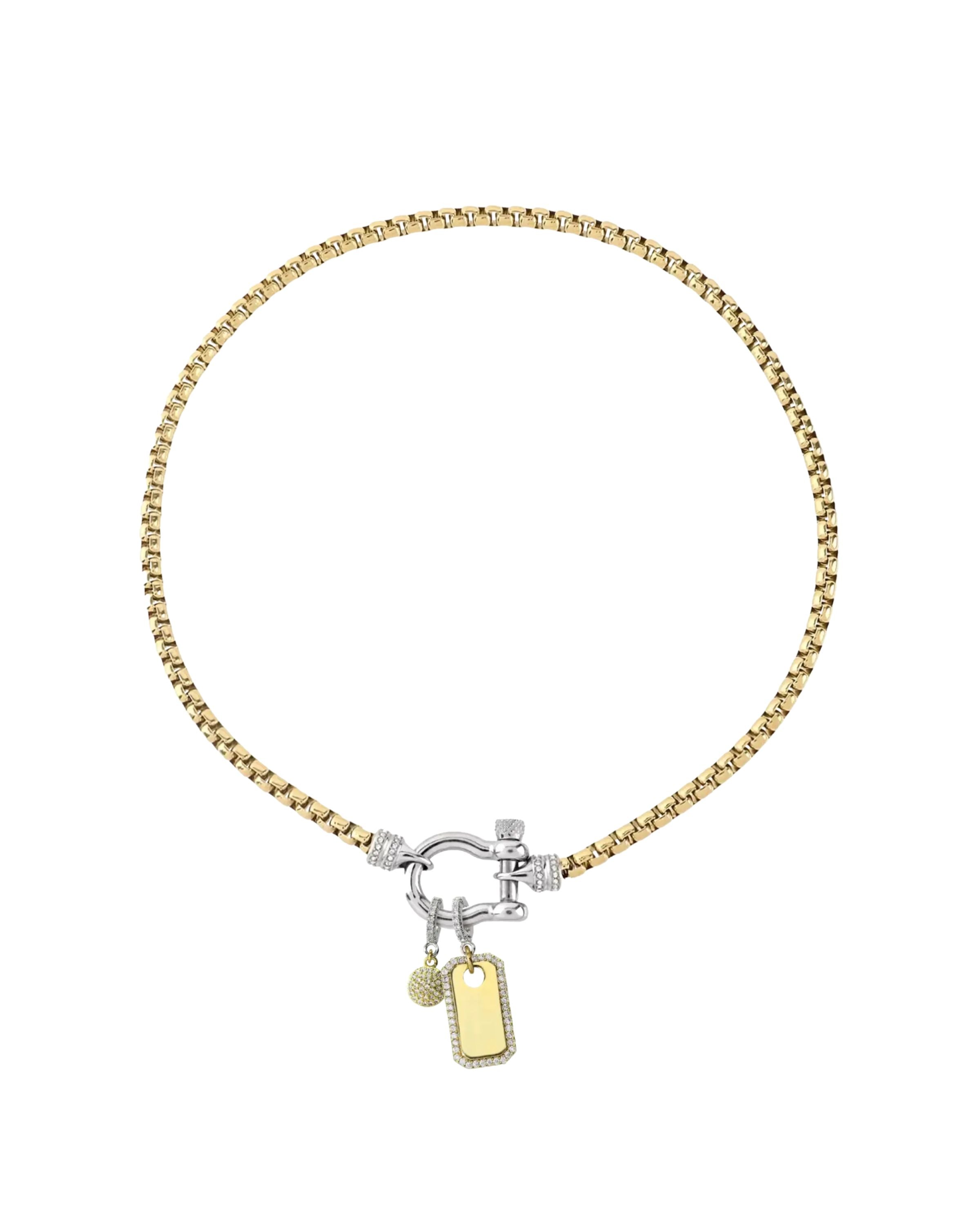 The Herradura Signature Charm Party, a mixed-metal necklace featuring a gold chain, silver-tone herradura clasp, and 2 charm accents. ||| SILVER