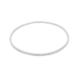 The Tennis Necklace, a silver necklace featuring a continuous line of sparkling diamond-like stones.