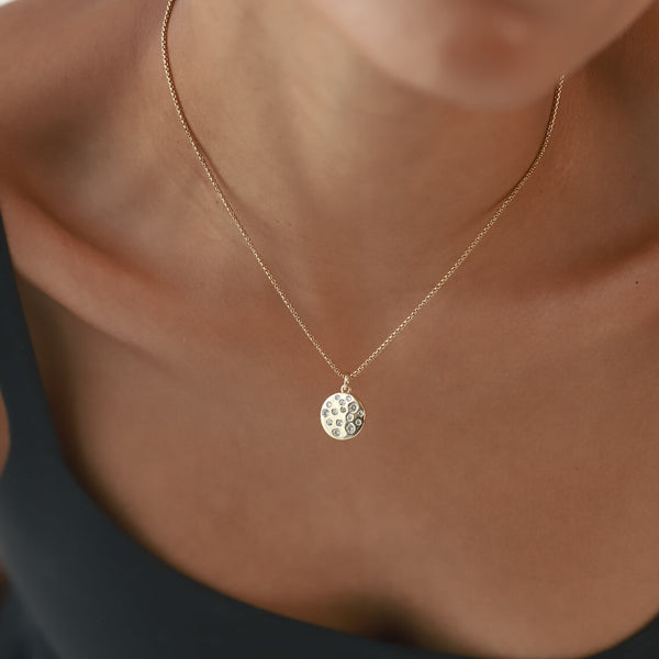 Model wearing the DALMATIAN NECKLACE which is made of 1mm wide 18k gold plated Stainless steel chain with 18K gold plated sterling silver with encrusted zirconia charm.