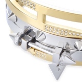 The Spiked Armor Bracelet Stack, a four-piece gold and silver bracelet stack featuring bangles with spike accents, diamond-like stones.