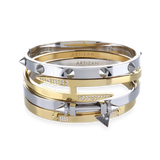 The Spiked Armor Bracelet Stack, a four-piece gold and silver bracelet stack featuring bangles with spike accents, diamond-like stones.


