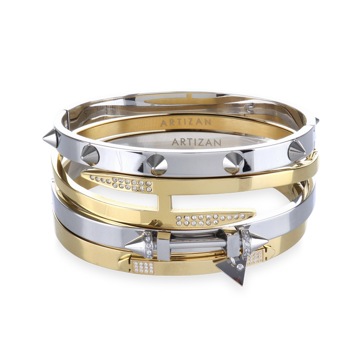 The Spiked Armor Bracelet Stack, a four-piece gold and silver bracelet stack featuring bangles with spike accents, diamond-like stones.


