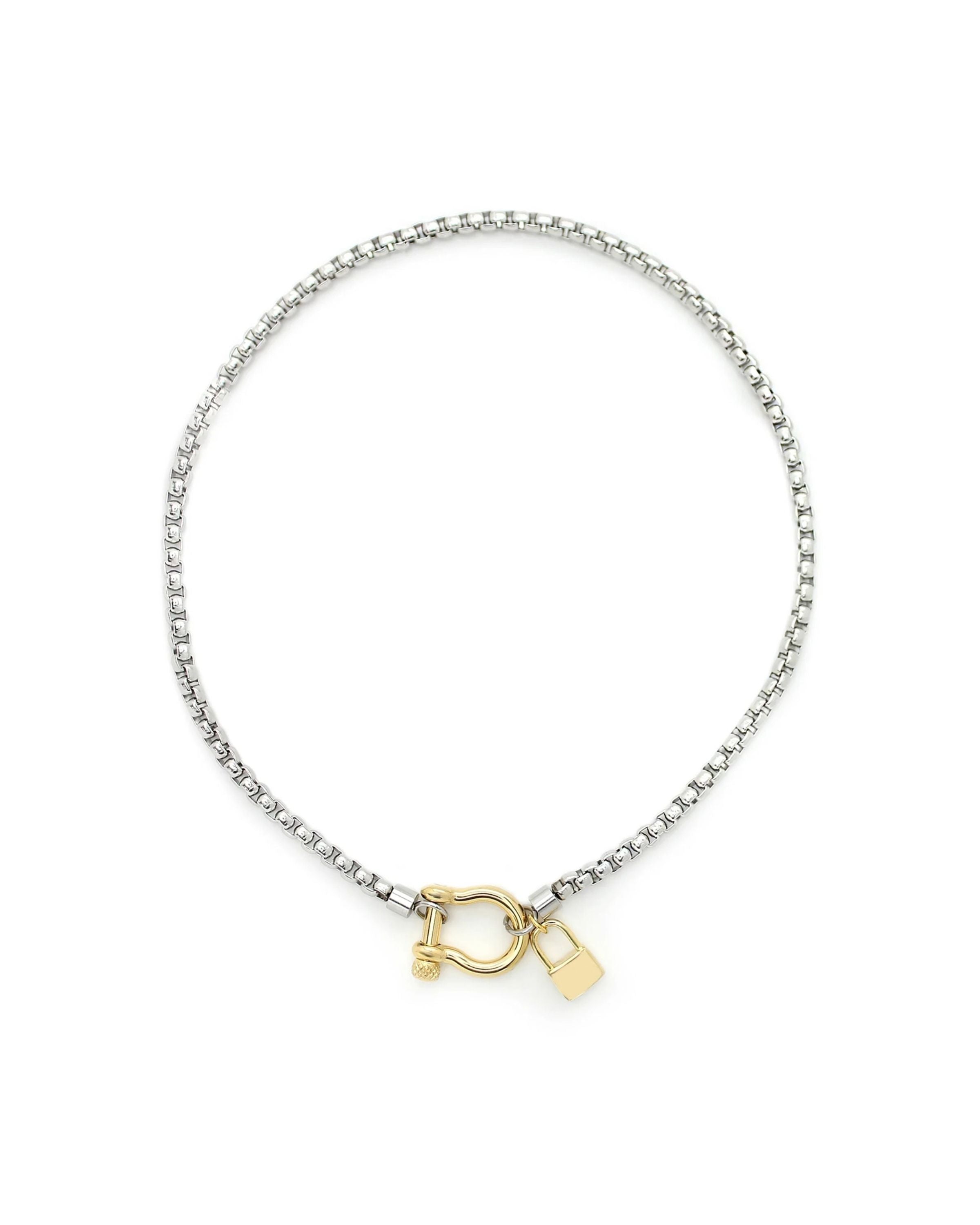 The Herradura Lock Single Necklace, a silver chain necklace with a gold lock charm.