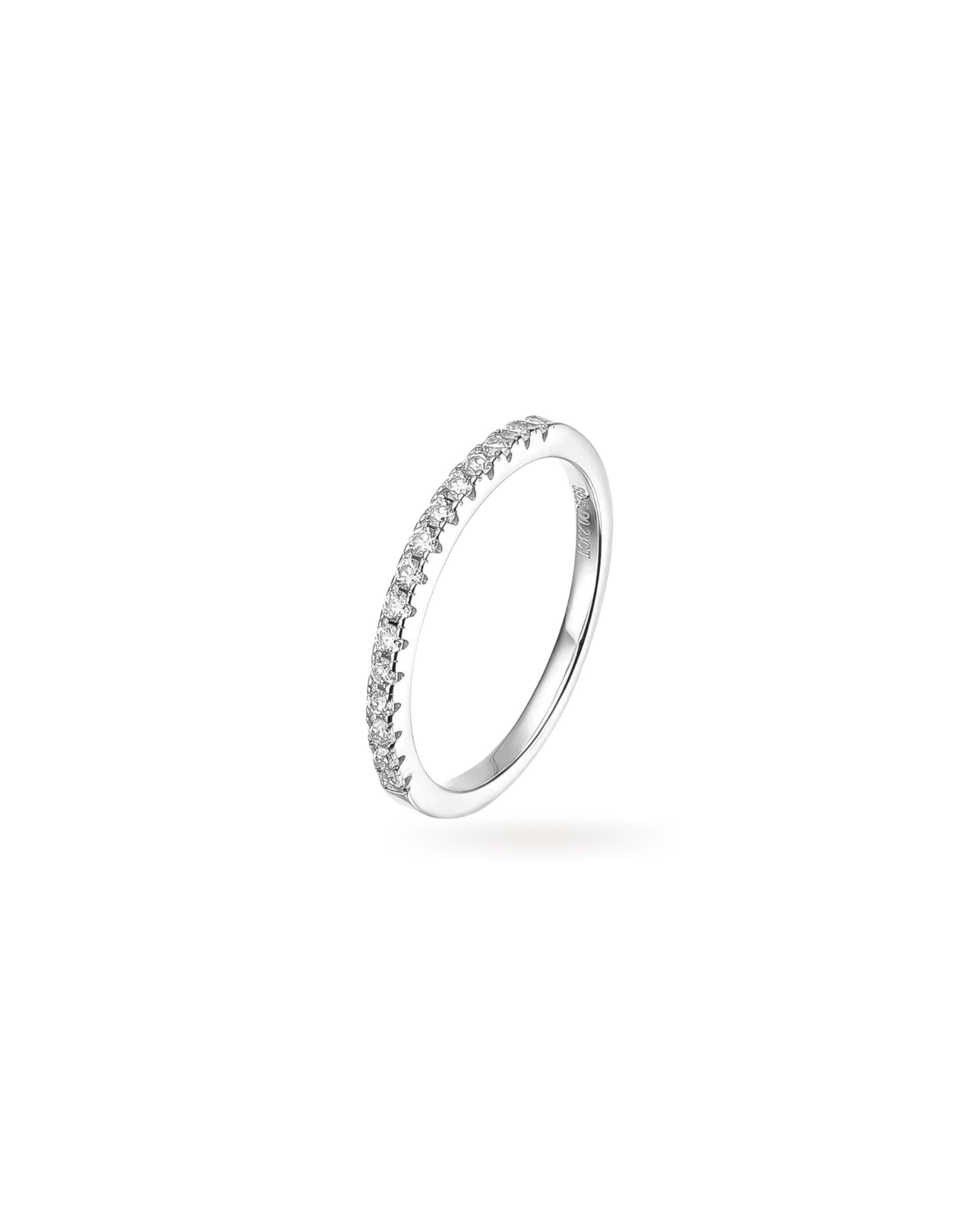 The Half Eternity Band Ring, a silver ring featuring a half-circle of sparkling diamond-like stones.