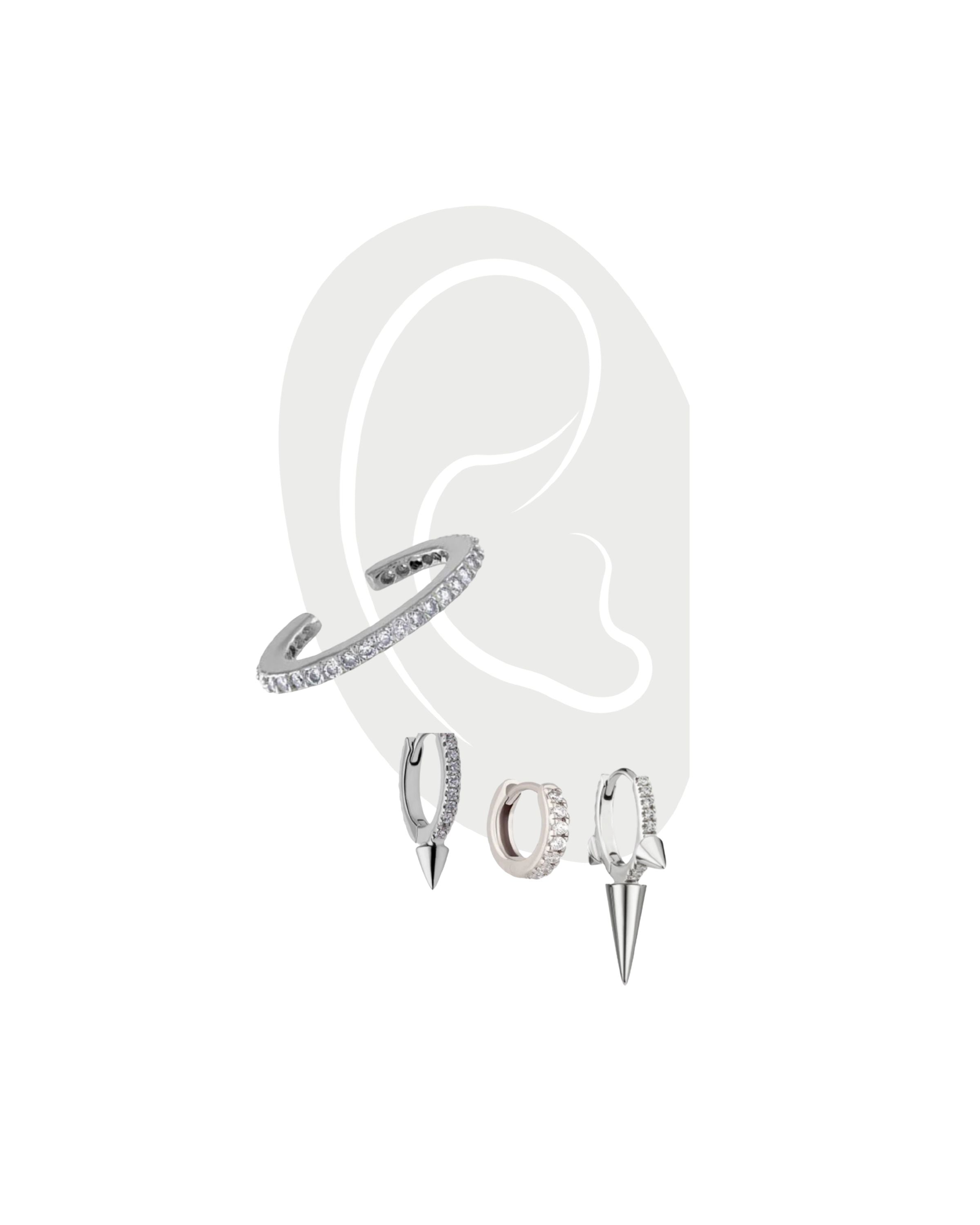 EAR PARTY SET - 3 & 2 HOLES in Silver which comes with 5 earrings. 4 hoop earrings and one ear cuff. On this photo are three hoop earrings one with small spike and the other has a longer spike to it. the other one is just plain hoop. In the middle of the ear is the clear cuff earring in silver.. ||| SILVER