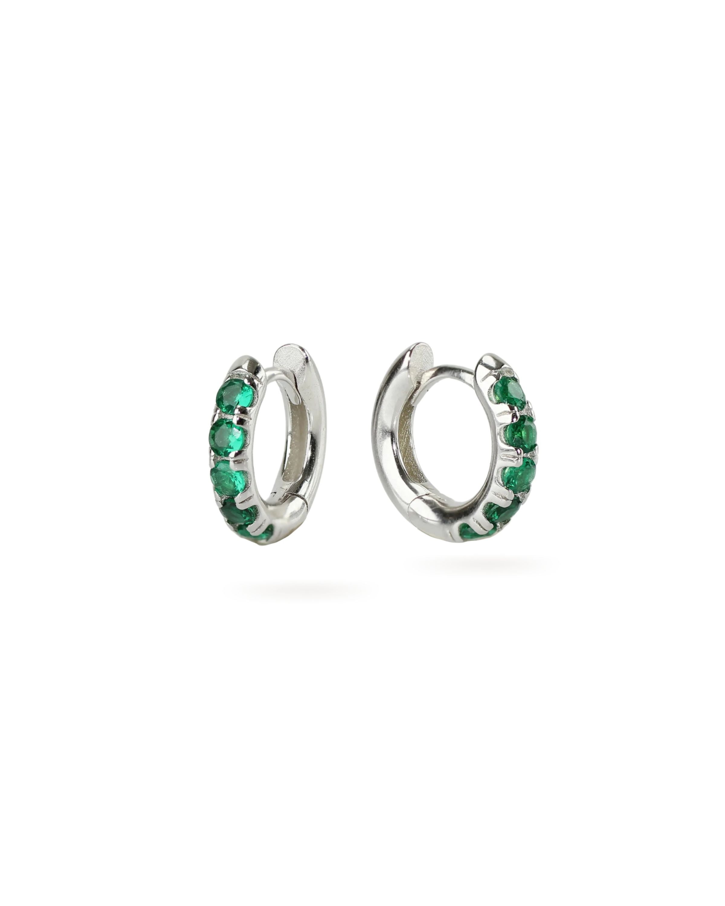 The Eternity Emerald Hoops, a pair of silver hoops featuring emerald accents.