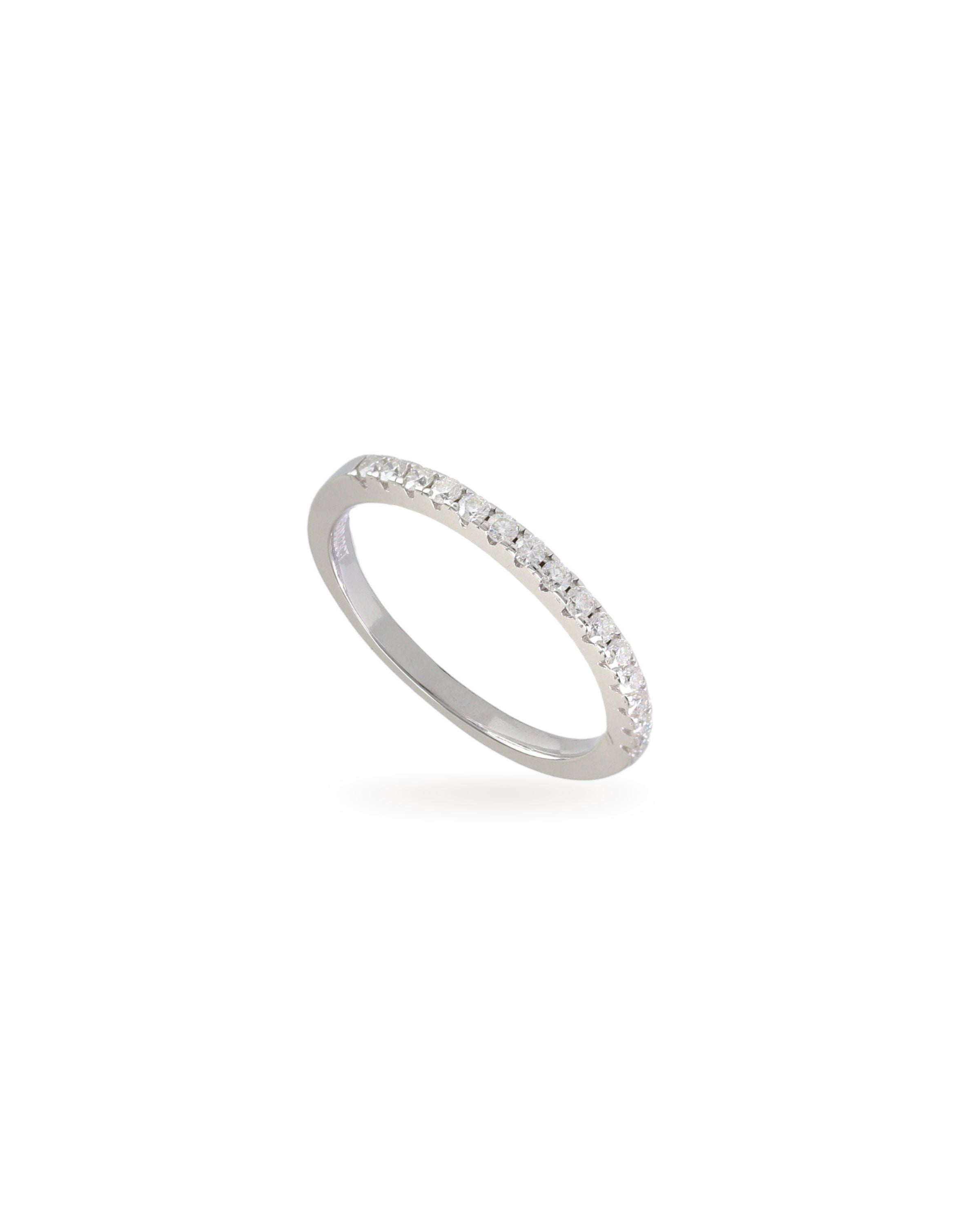 The Half Eternity Band Ring, a silver ring featuring a half-circle of sparkling diamond-like stones.