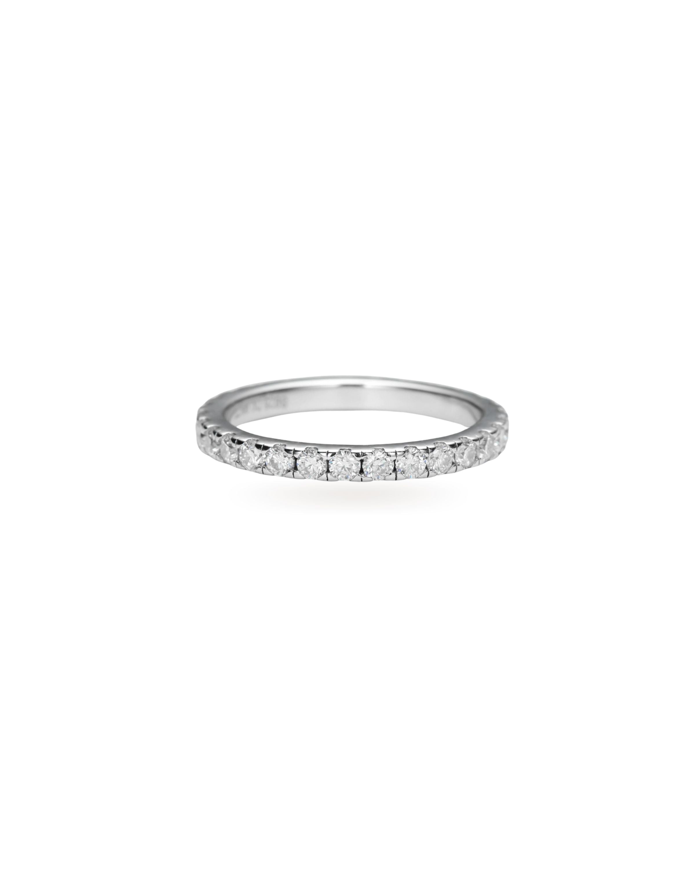 The Full Eternity Band Ring, a silver ring featuring a continuous line of sparkling diamond-like stones.