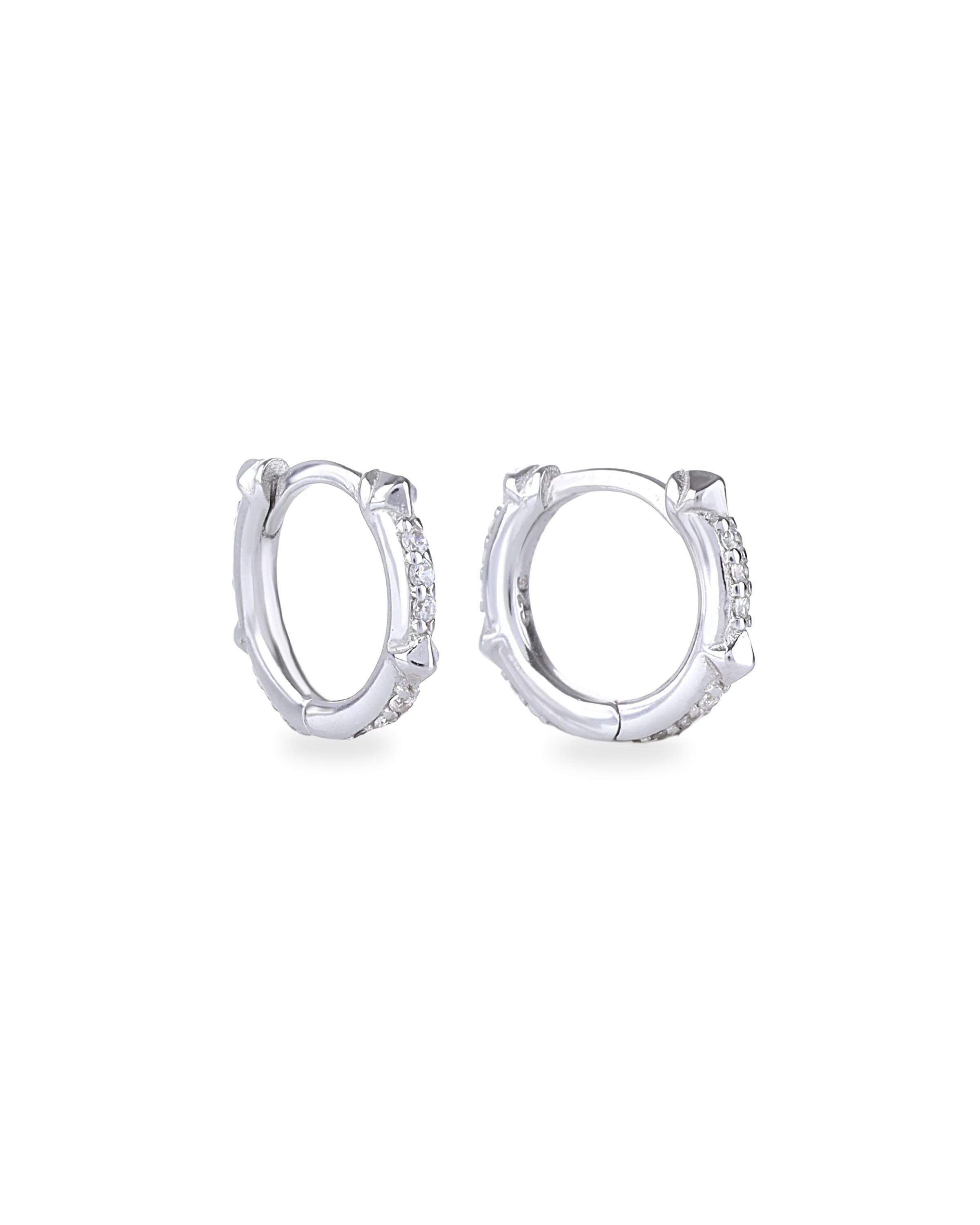 The Touch Spike Hoop, a silver hoop earring with a unique spike design and accents of sparkling cubic zirconia stones.