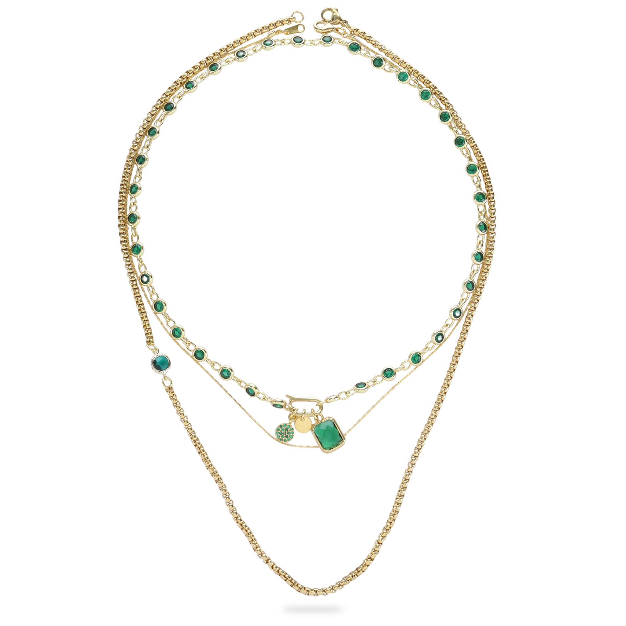 The CAN OPENER GOLD EMERALD NECKLACE SET which is a three-piece Layered Gold Necklace Set featuring a Can Opener chain with emerald-cut gemstones and a delicate pendant necklace with a green gemstone.