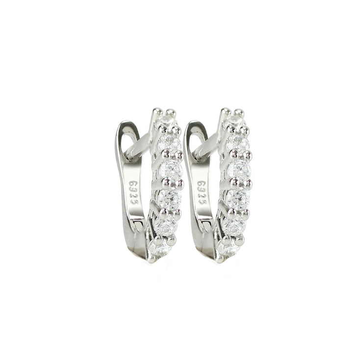 The Prong Hoops, which are a pair of silver hoop earrings, feature a stunning row of sparkling prong-set cubic zirconia stones along the front for a dazzling effect. These elegant hoops are perfect for adding a touch of glamour to any outfit, making them versatile for both everyday wear and special occasions ||| SILVER