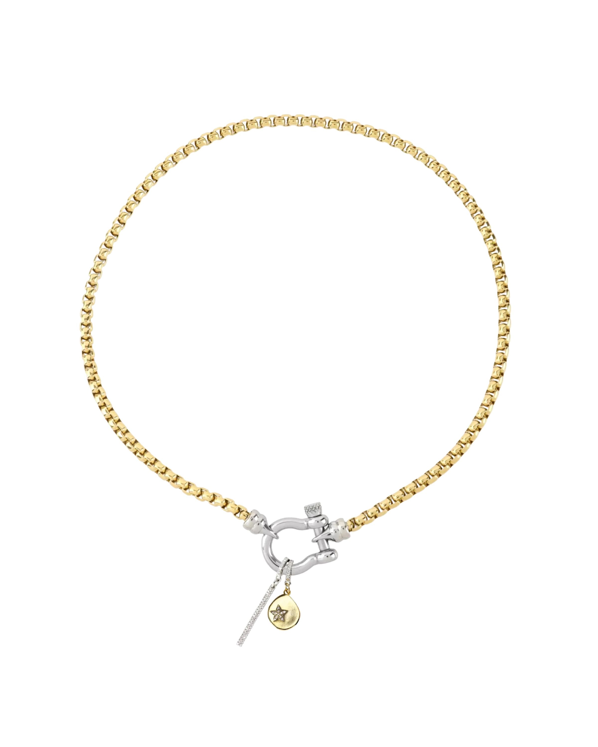 The HERRADURA SIGNATURE DOUBLE TAKE featuring a gold chain with a silver horseshoe clasp and dangling charms, including a pavé bar and a gold star pendant. ||| SILVER