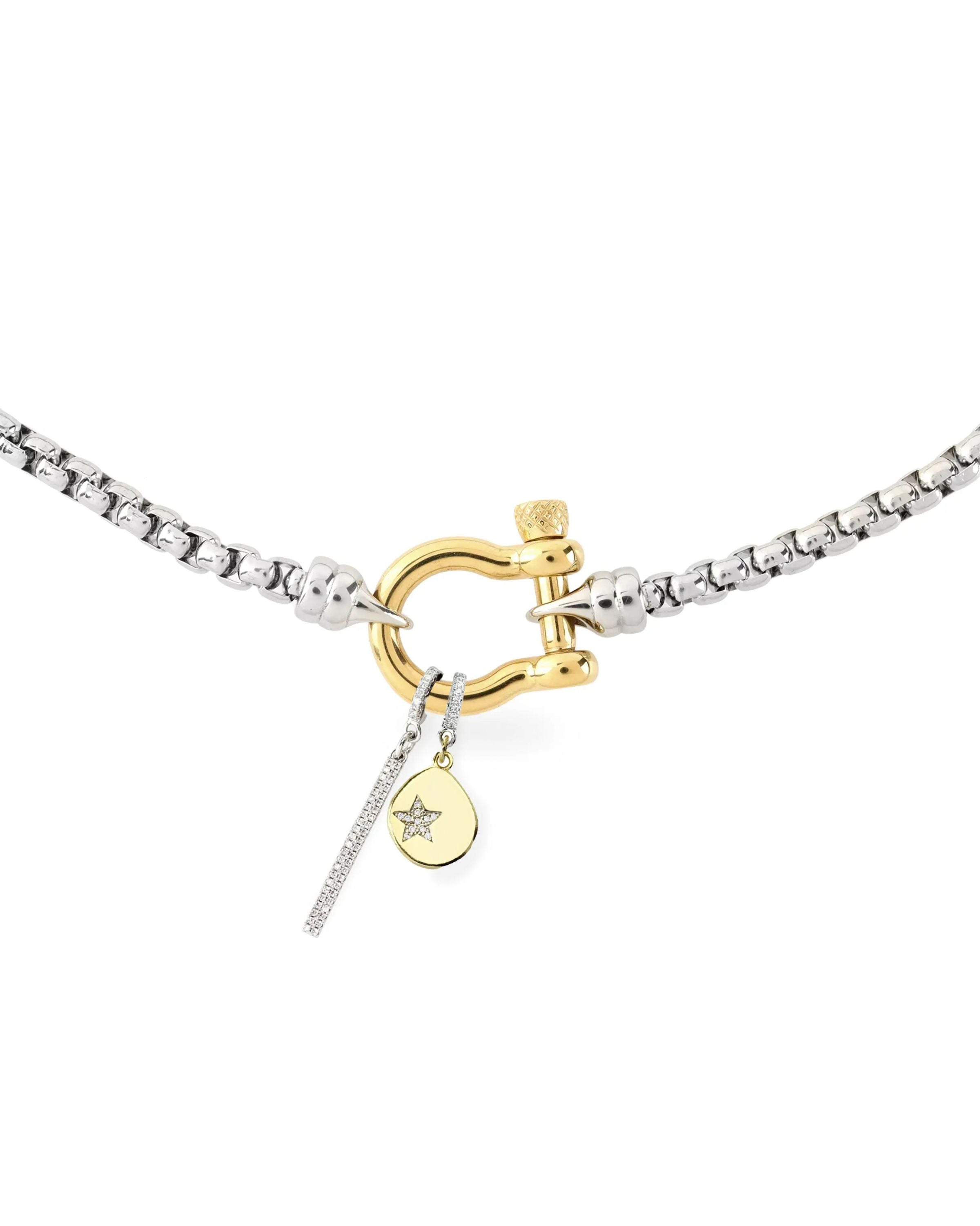 The HERRADURA SIGNATURE DOUBLE TAKE featuring a silver chain with a gold horseshoe clasp and dangling charms, including a pavé bar and a gold star pendant.|||Gold