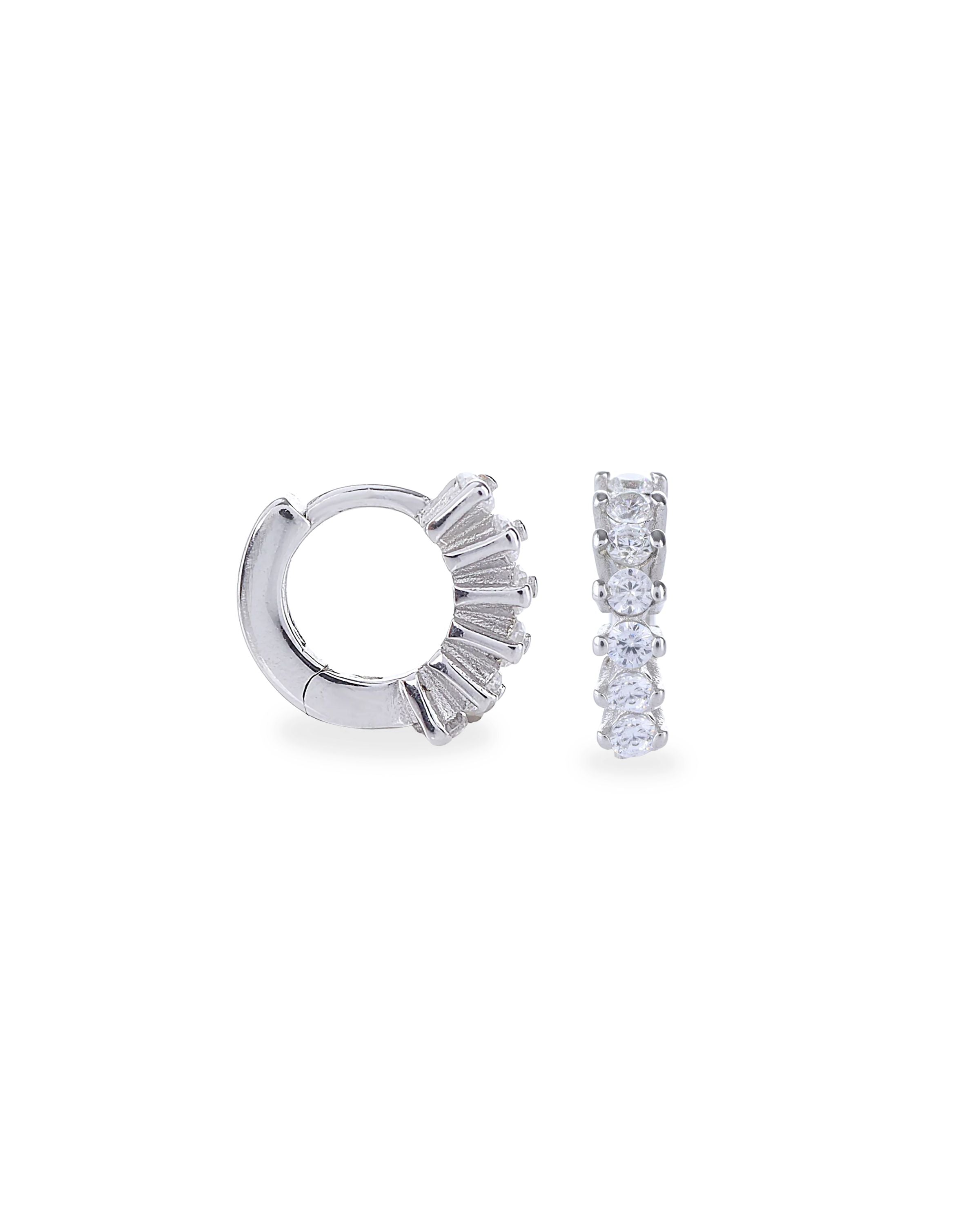 The Tiny Huggies Hoop, a pair of small silver hoop earrings that feature a row of sparkling cubic zirconia stones set in a  pointed, triangular pattern. ||| SILVER/8mm