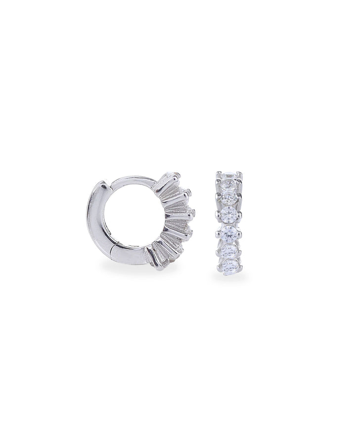 The Tiny Huggies Hoop, a pair of small silver hoop earrings that feature a row of sparkling cubic zirconia stones set in a  pointed, triangular pattern. ||| SILVER/8mm