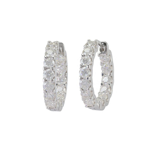 The Wraparound Maxi Huggies, a pair of silver hoop earrings completely encrusted with sparkling cubic zirconia stones.