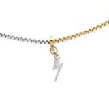The CHARMED OPPOSITES NECKLACE, a two-tone necklace with half gold and half silver chain, featuring a small Lightning charm hanging from the center. ||| Lightning Charm/MIX