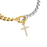 The OPPOSITES ATTRACT CHAIN BRACELET, a two-tone bracelet with half gold Cuban links and half silver box chain, featuring a small cross charm hanging from the center. |||  Cross Charm/MIX