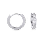 The Mini Clear Huggies, a pair of small silver hoop earrings with sparkling clear cubic zirconia stones.||| SILVER