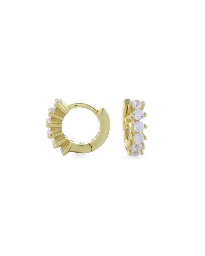 The Tiny Huggies Hoop, a pair of small gold hoop earrings that feature a row of sparkling cubic zirconia stones set in a  pointed, triangular pattern. ||| GOLD/8mm