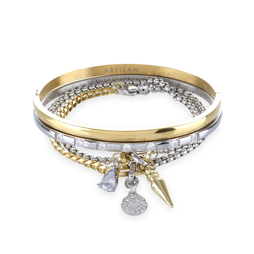 The Mix Gear Bracelet Stack, a four-piece gold and silver bracelet stack featuring two bangles and two chains with a variety of charms, including a teardrop charm, a spike charm, and a disc charm accented with diamond-like stones.