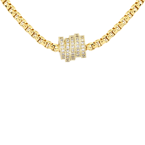 The Nut Necklace, a gold box chain with a gold nut-shaped pendant encrusted with stones. ||| GOLD