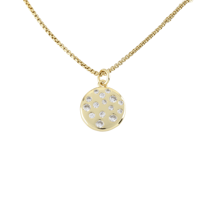 The DALMATIAN NECKLACE which is made of 1mm wide 18k gold plated Stainless steel chain with 18K gold plated sterling silver with encrusted zirconia charm.