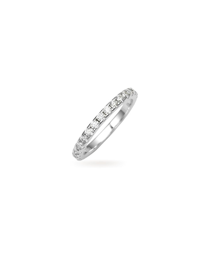 The Full Eternity Band Ring, a silver ring featuring a continuous line of sparkling diamond-like stones.