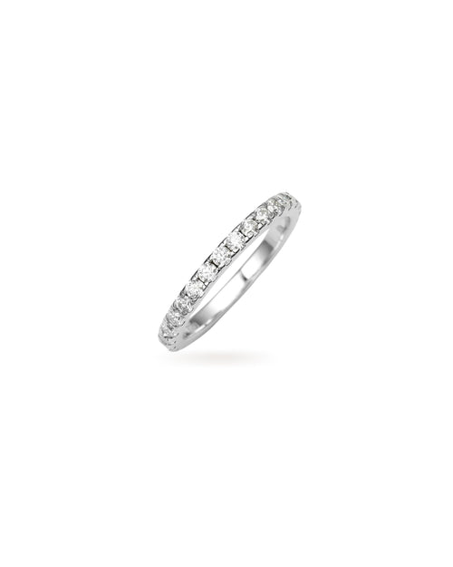 The Full Eternity Band Ring, a silver ring featuring a continuous line of sparkling diamond-like stones.