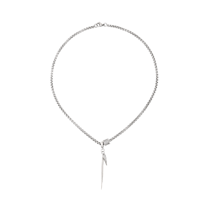 The Needle Necklace, which is a single-piece silver necklace, features a sleek chain with a bold needle-shaped pendant, creating a modern and edgy statement for any look.