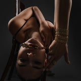The Abuela Olga's Bracelet Stack, a three-piece set of gold chunky chain bracelets.


